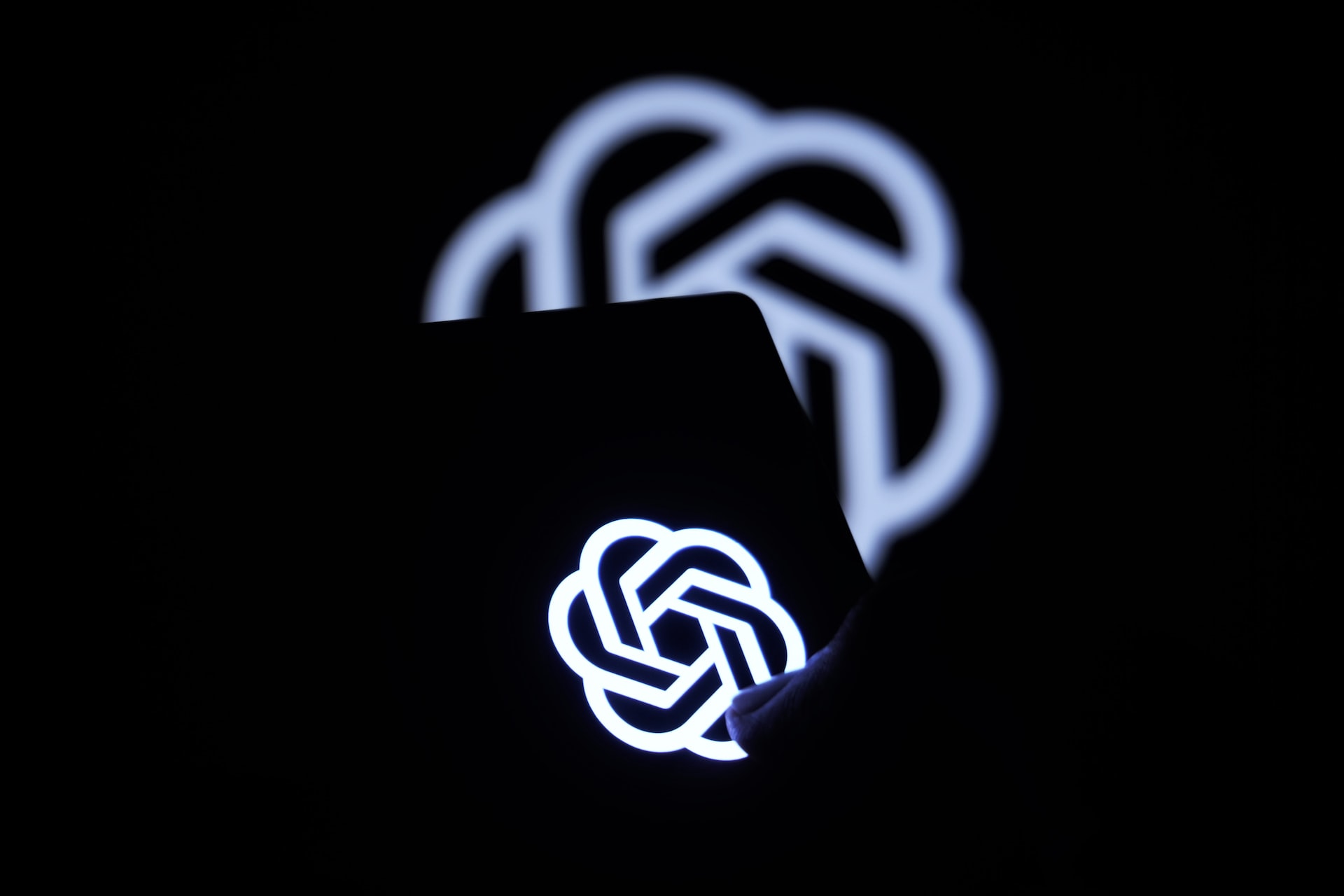 a close up of a cell phone in the dark